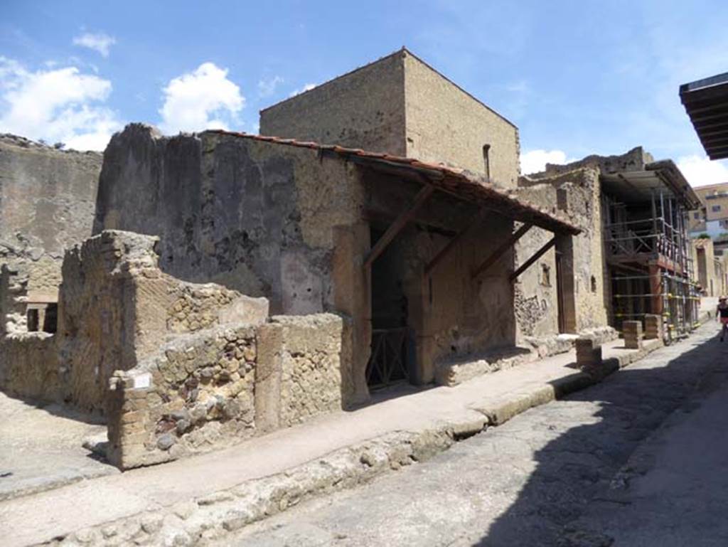 III.17, in centre, Herculaneum, July 2015. Looking north along west side of Cardo IV Inferiore. Photo courtesy of Michael Binns.